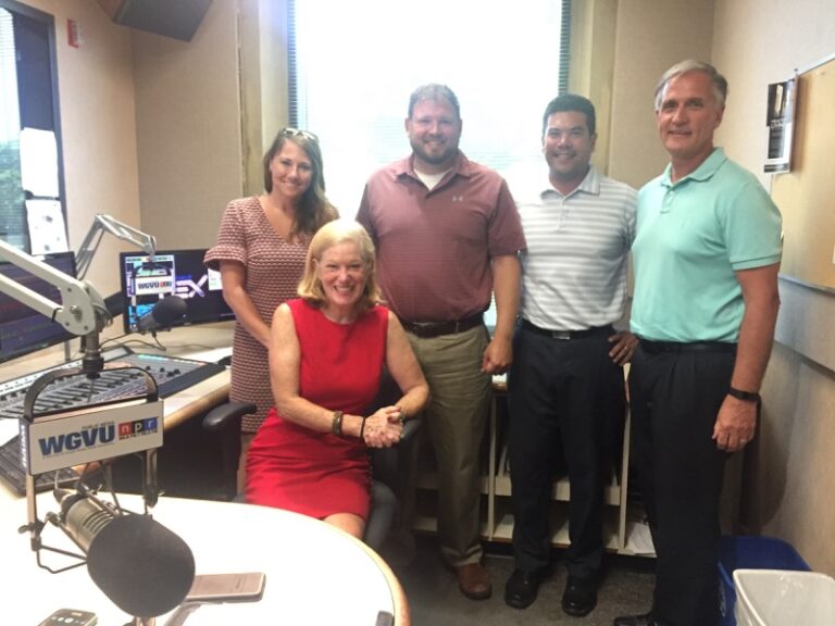 The Your Biz Your Town cast and crew smiles at the camera.