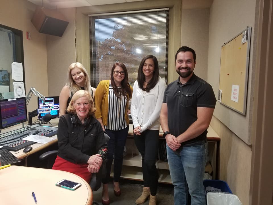 Kim Bode poses with members of the Your Biz Your Town team