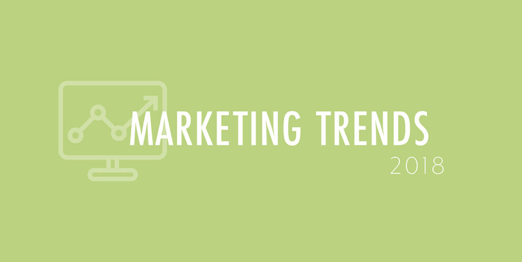 A green background features a cartoon laptop and the words, "Marketing Trends 2018"