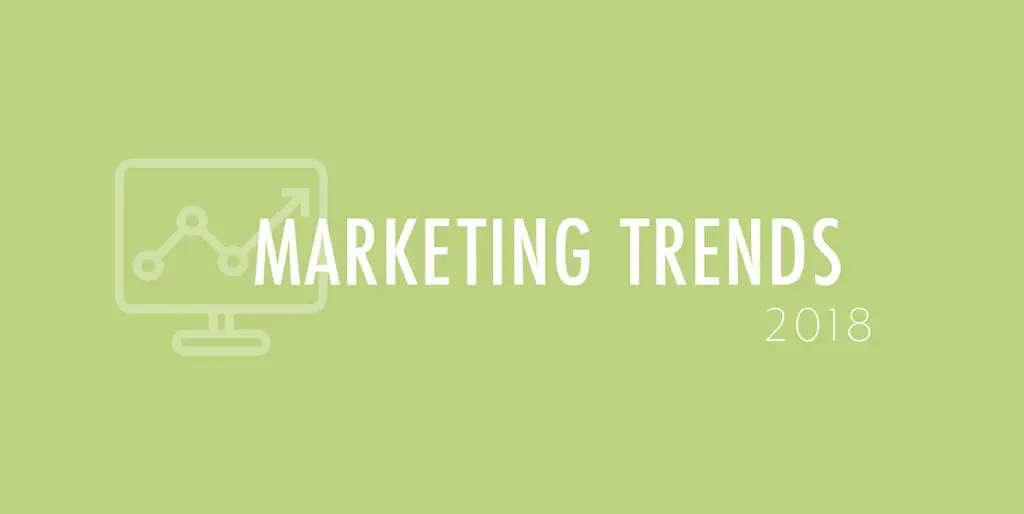 A green background features a cartoon laptop and the words, "Marketing Trends 2018"