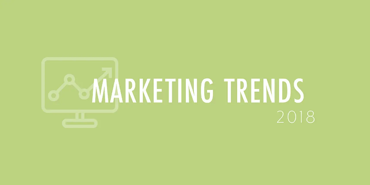 A green background features a cartoon laptop and the words, "Marketing Trends 2018"