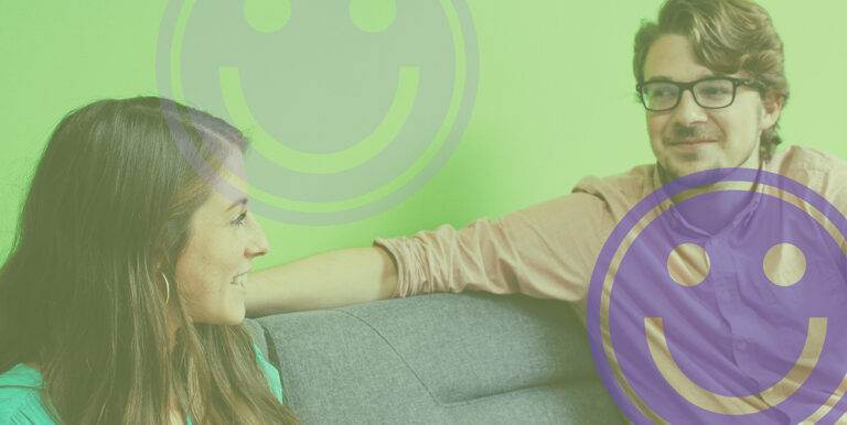 Emily Potts and Alex Rens smile on the couch at the 8THIRTYFOUR office