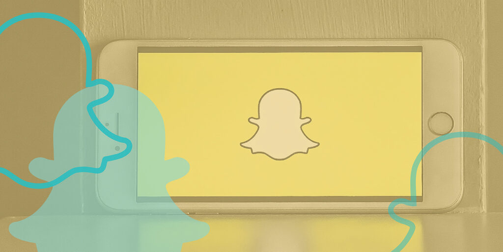 An iPhone displays the SnapChat ghost