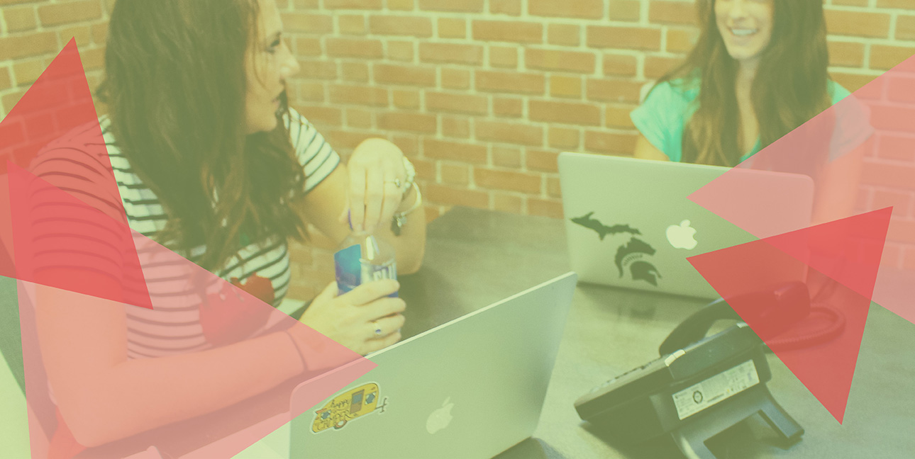 Kim Bode and Emily Potts discuss business at the conference table in the 8THIRTYFOUR office