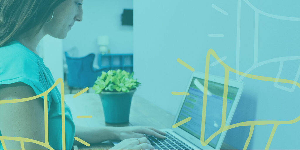 Emily Potts works at her laptop in the 8THIRTYFOUR office