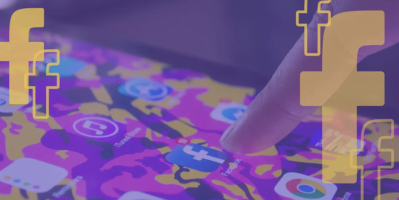 A finger selecting a Facebook app on an tablet