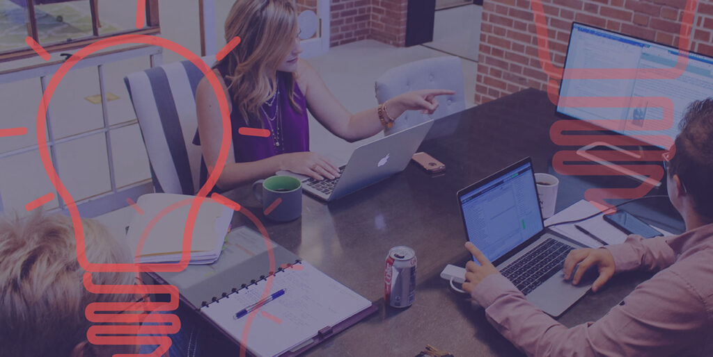 Sarah Abel, Kayden Grinwis, and a client sit at the 8THIRTYFOUR conference table and discuss digital marketing