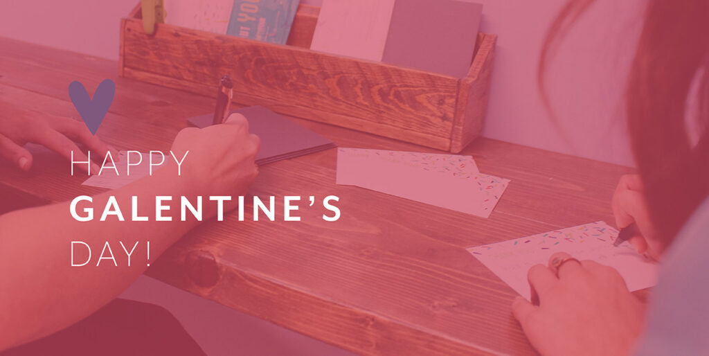 Kim Bode and Emily Potts write letters in the 8THIRTYFOUR office.