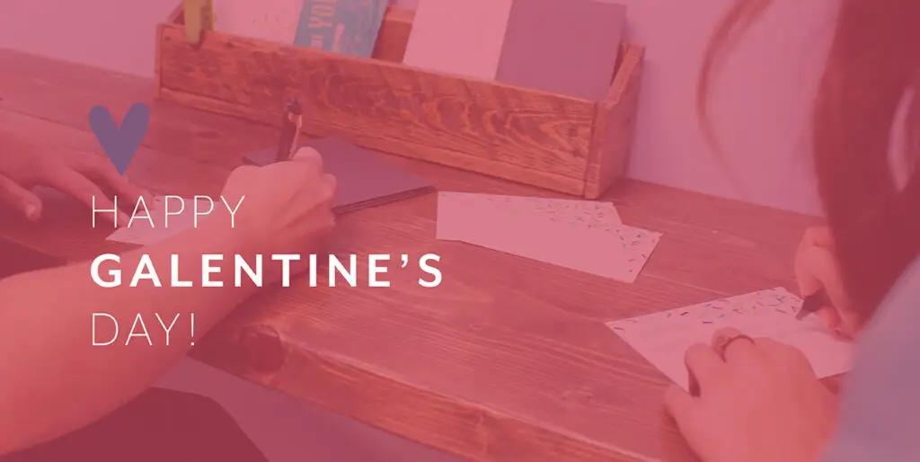 Kim Bode and Emily Potts write letters in the 8THIRTYFOUR office.