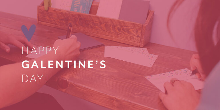 Kim Bode and Emily Potts write letters in the 8THIRTYFOUR office.