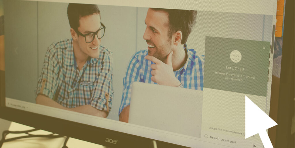 Megan Leo pulls up a chatbot on a website at their desk in the 8THIRTYFOUR office.