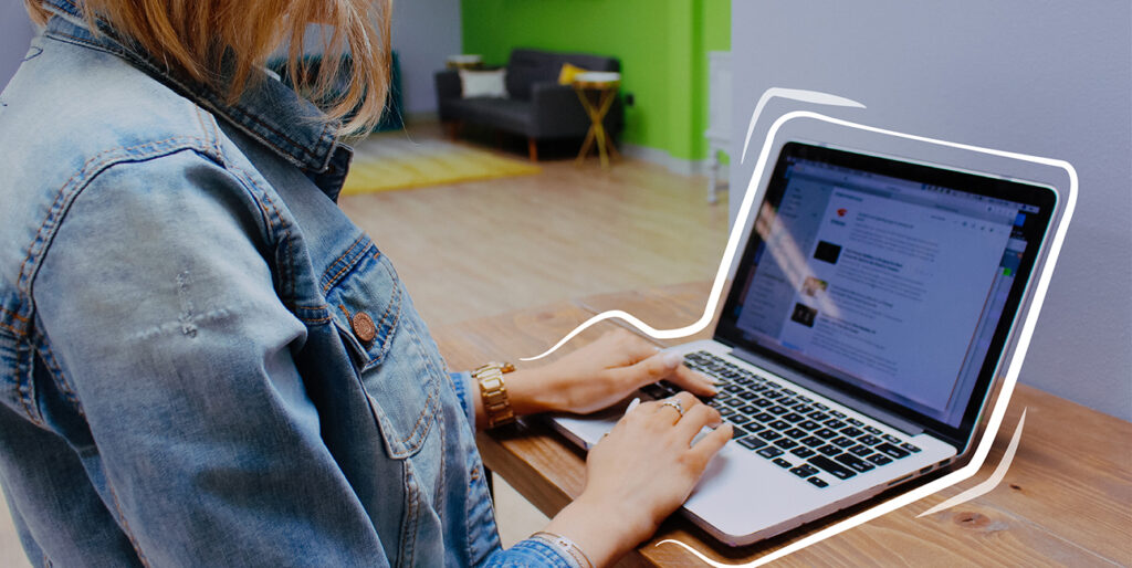 Morgan Shaffer browses her news sources on her laptop inside of the 8THIRTYFOUR office.