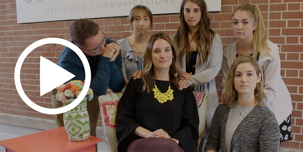 A picture of the 834 team surrounding the Director of Client Success, Jen.