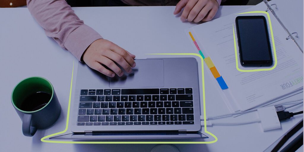 Kayden Grinwis works on his laptop inside of the 8THIRTYFOUR office.