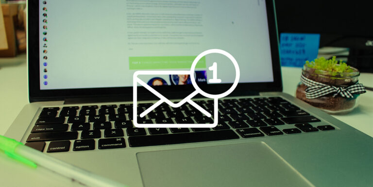 An image of a computer with an email icon in the foreground.