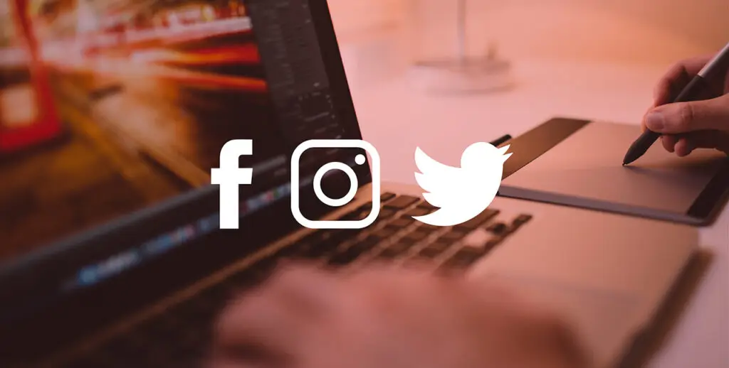 An image of a laptop with social media sharing icons overlay.