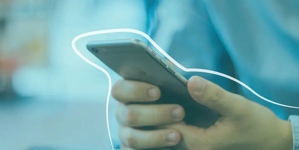 An image of a person holding a phone outlined in white.