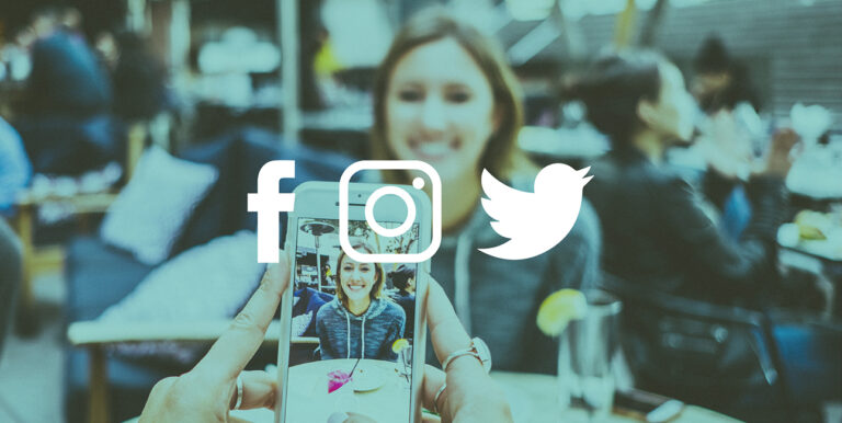 A photo of someone taking a photo of another person in a crowded restaurant. Facebook, Instagram and Twitter icons are placed on top of the photo.