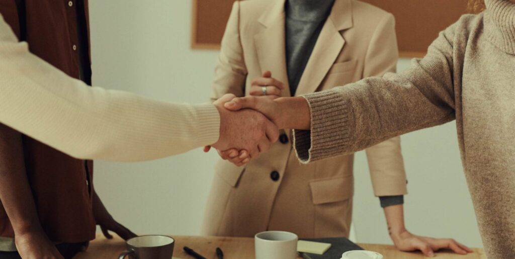 An image of two people shaking hands.