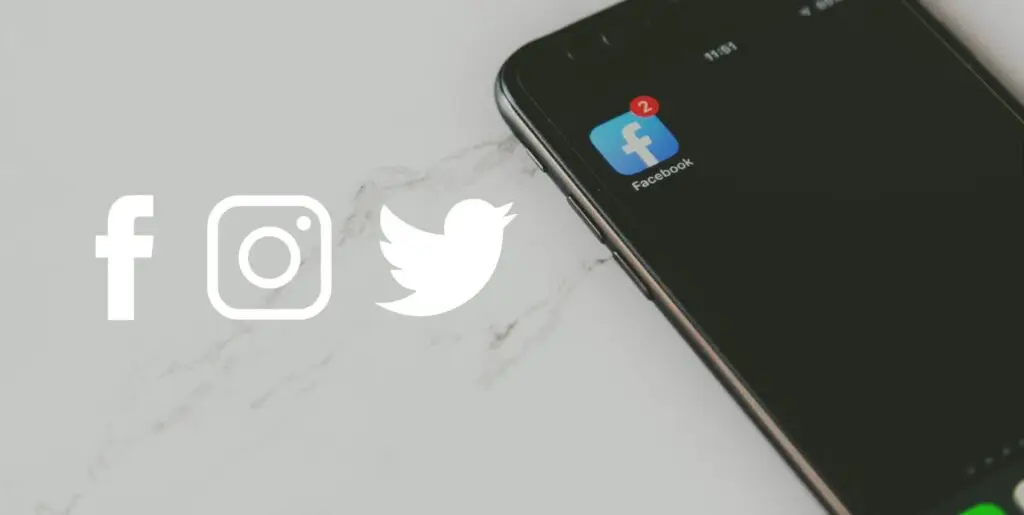 An image of a phone on a marble counter with the facebook app in focus.
