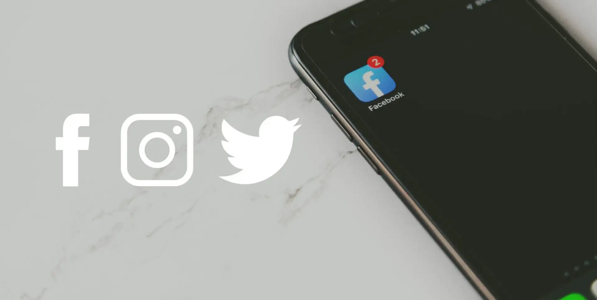 An image of a phone on a marble counter with the facebook app in focus.