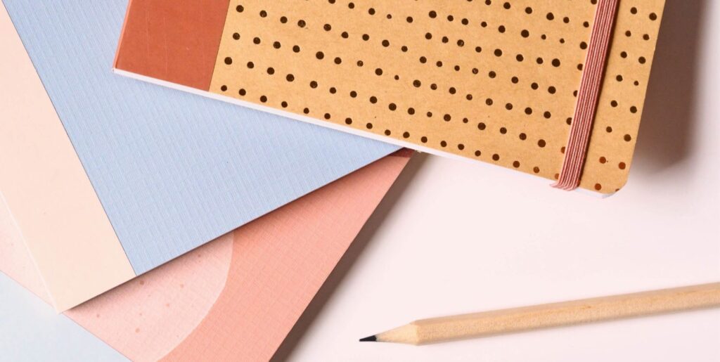 A picture of office supplies on a white table.