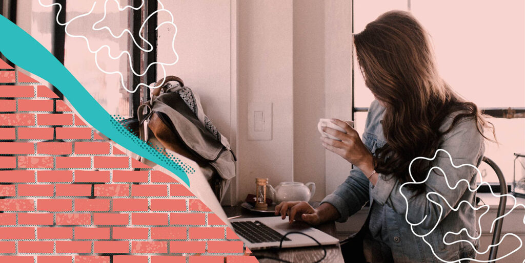 A girl sitting in a cafe sipping coffee.