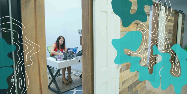 A female business owner typing on her laptop.