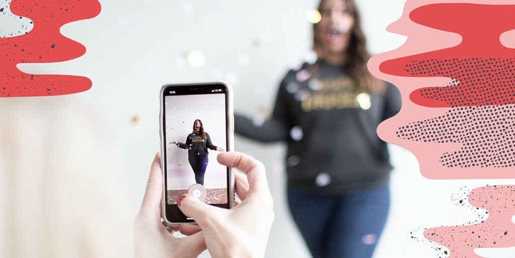 Someone taking a photo of a girl through an iPhone.