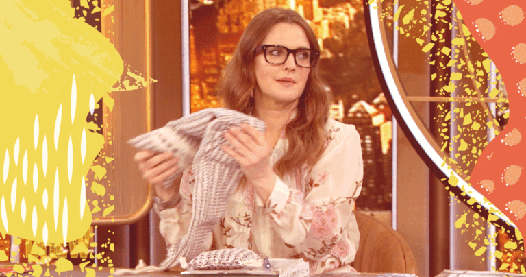 Drew Barrymore holds up Lavender Life's neck wrap