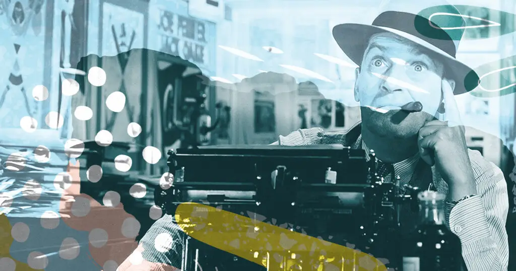 man at a typewriter with cigar