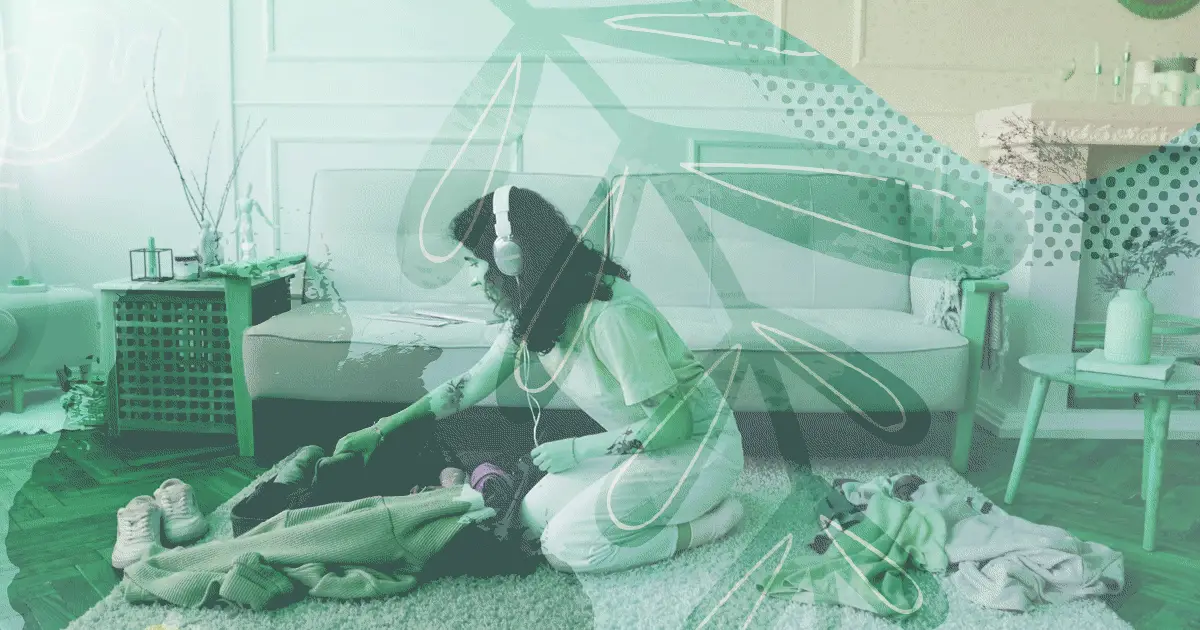 Woman searching through bag wearing headphones