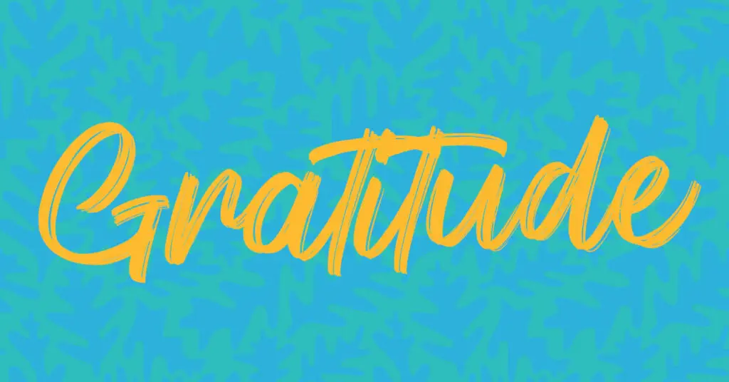 A blue background with yellow text that reads, "Gratitude"