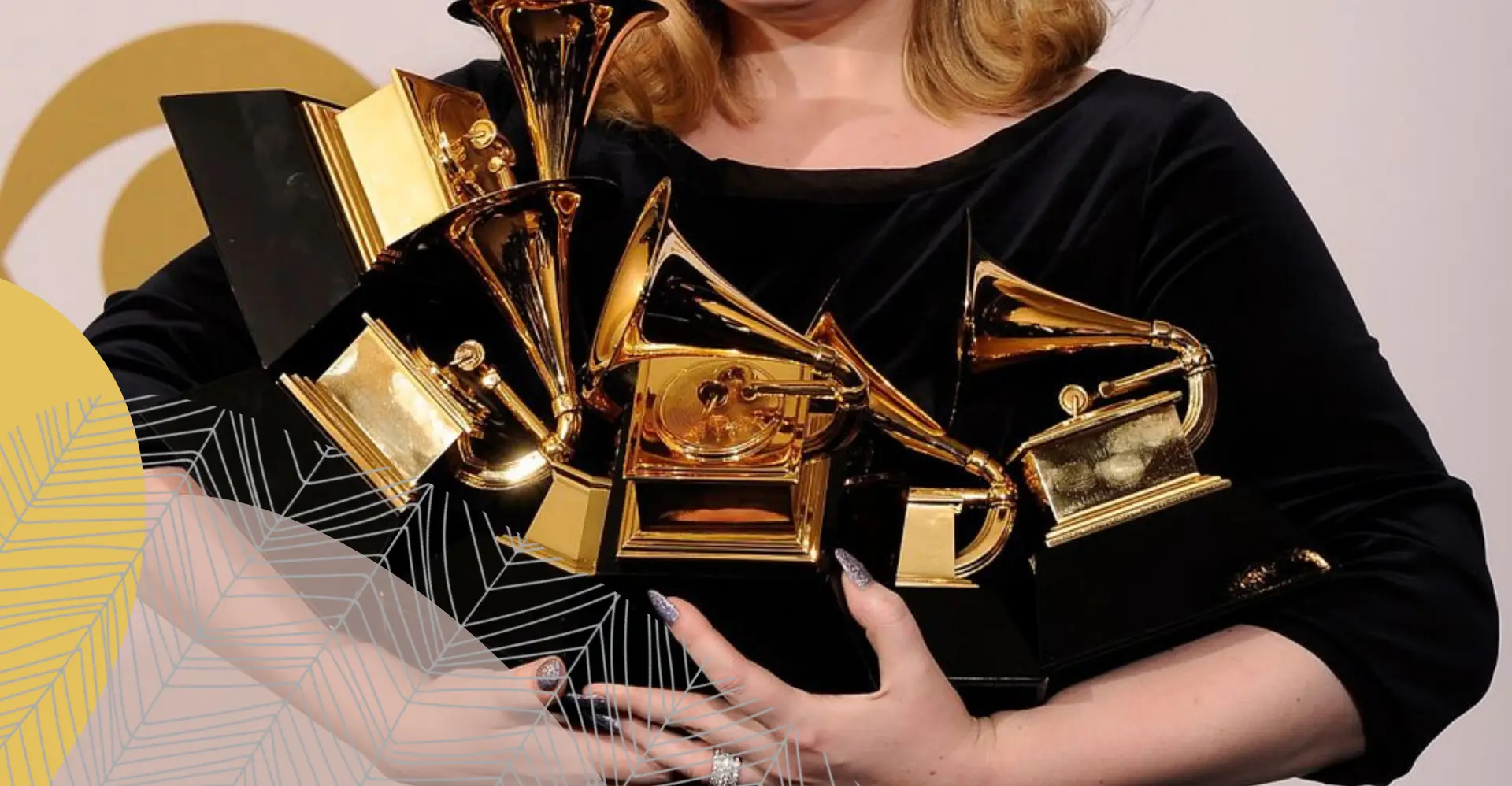 A woman holds a bunch of PR awards