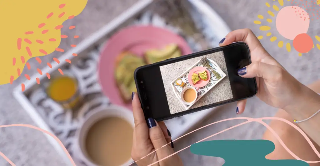 Person taking photos of food