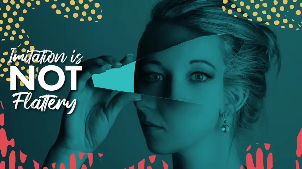 A woman holding a mirror in front of her face