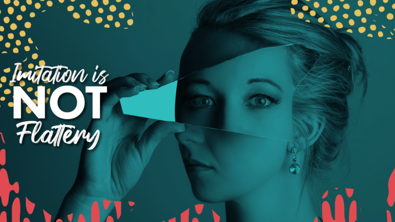 A woman holding a mirror in front of her face