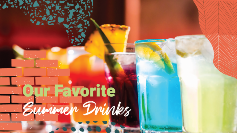 A line of colorful drinks with fruit and garnishes