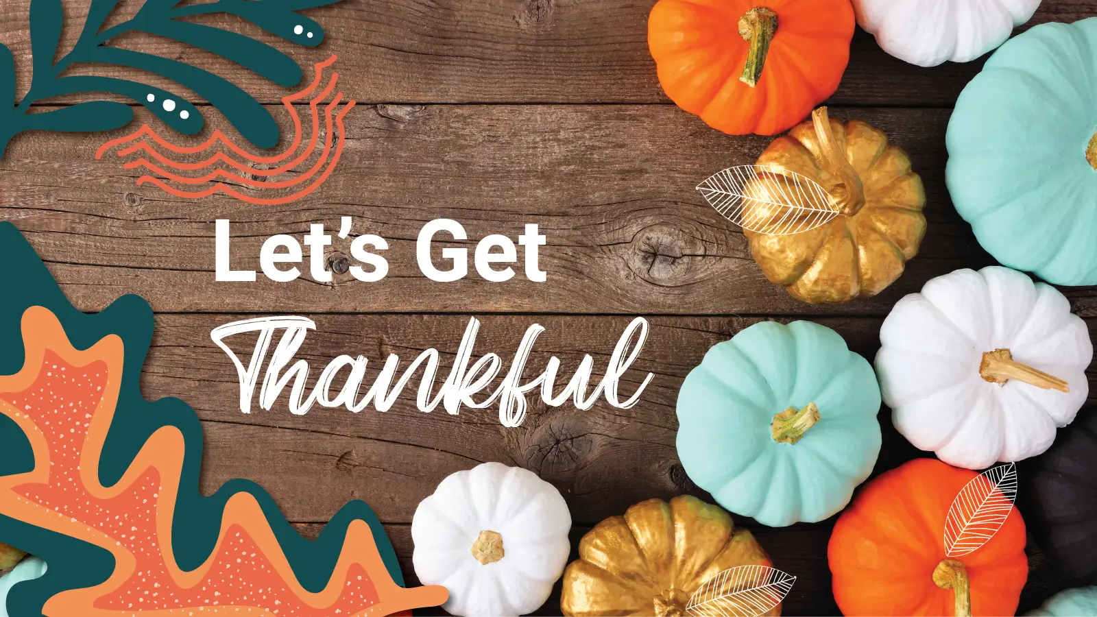 An array of different colored pumpkins sit on top of a wooden table "Let's Get Thankful"