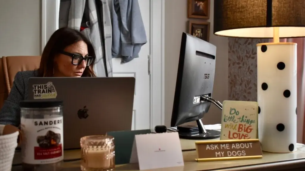 Kim Bode, founder and CEO of 8THIRTYFOUR works at her desk.