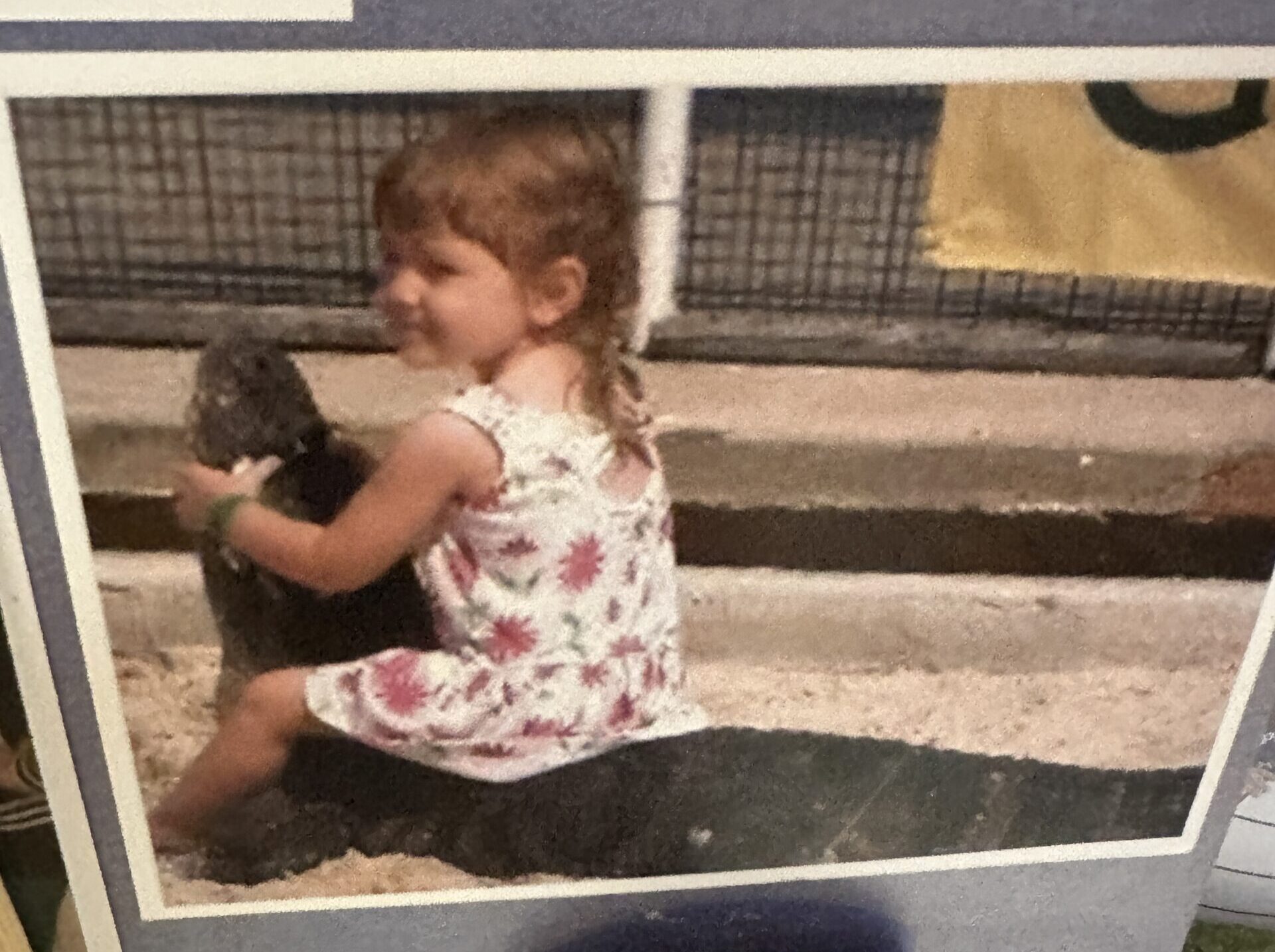 A young Elena Cousino on a rocking horse.
