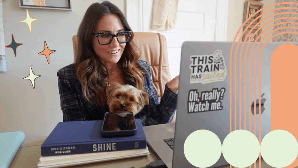 Kim Bode talks to someone on a call from her desk.