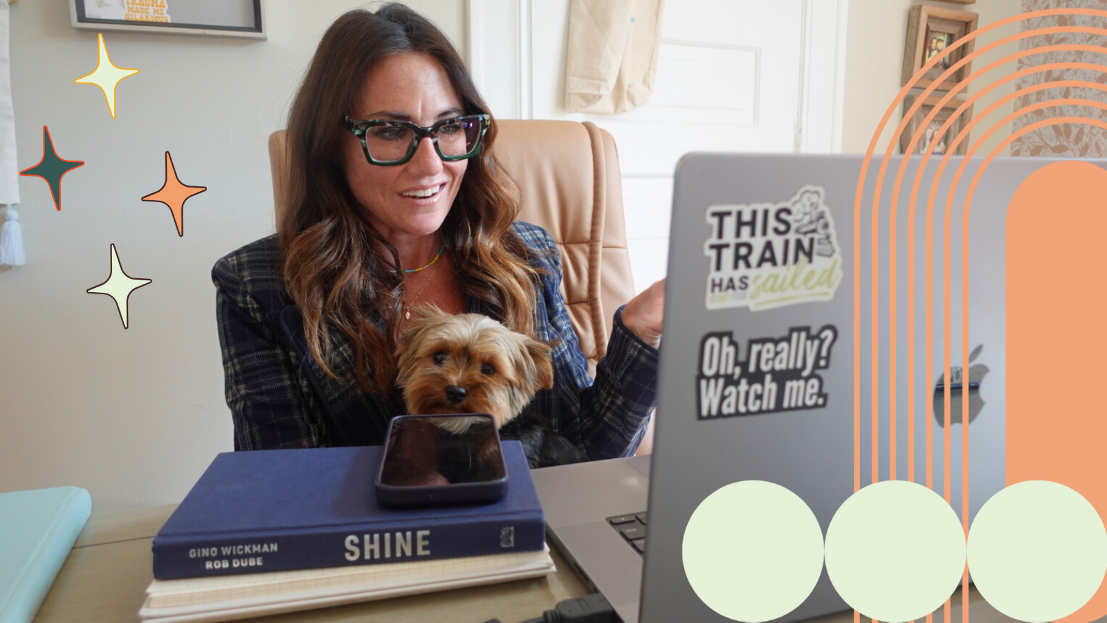 Kim Bode talks to someone on a call from her desk.