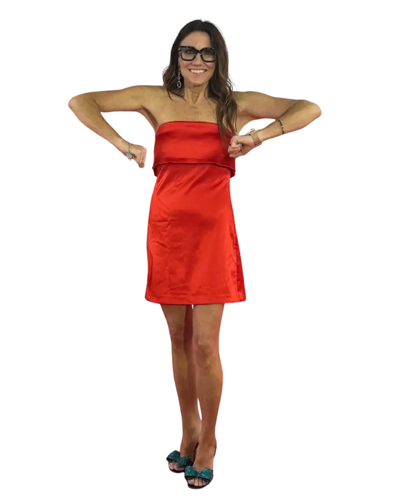 Kim posing in a red dress