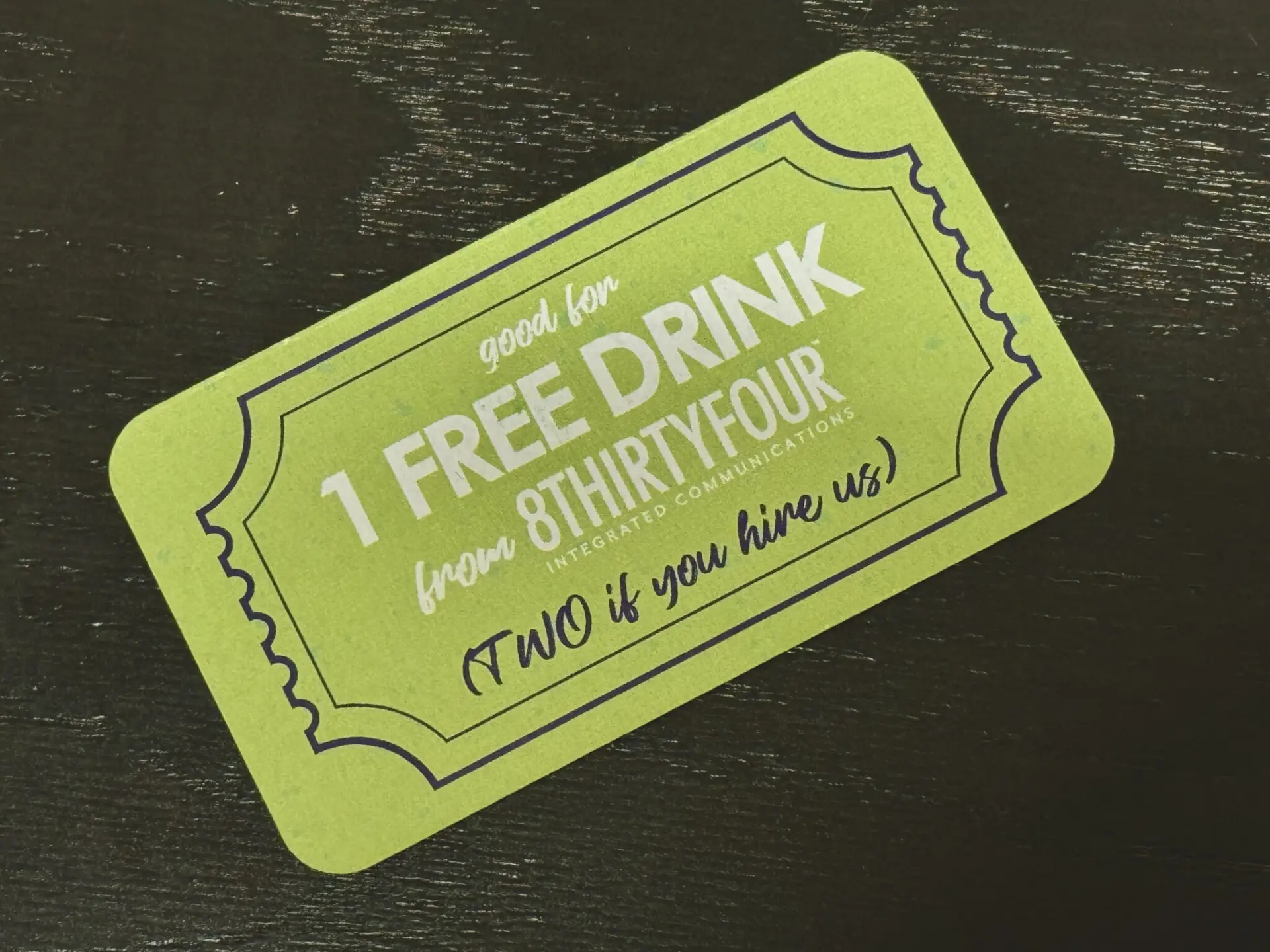 One free drink ticket from 8THIRTYFOUR with a green background and and white and blue lettering.