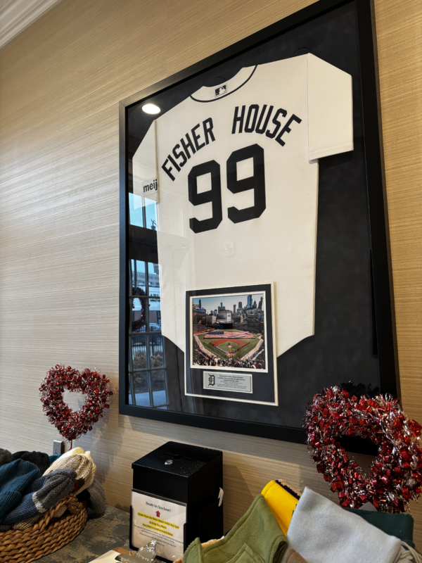 a framed baseball jersey at the fisher house