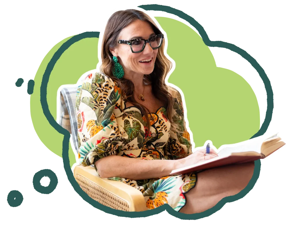 Kim Bode smiles while writing in her journal.