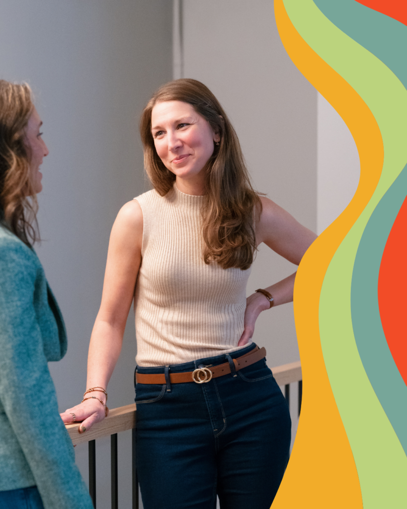 two women talking and smiling