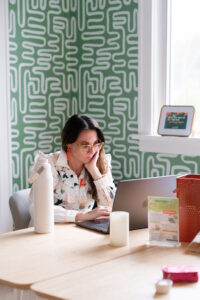 women looking at her laptop
