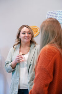 two women smiling and talking